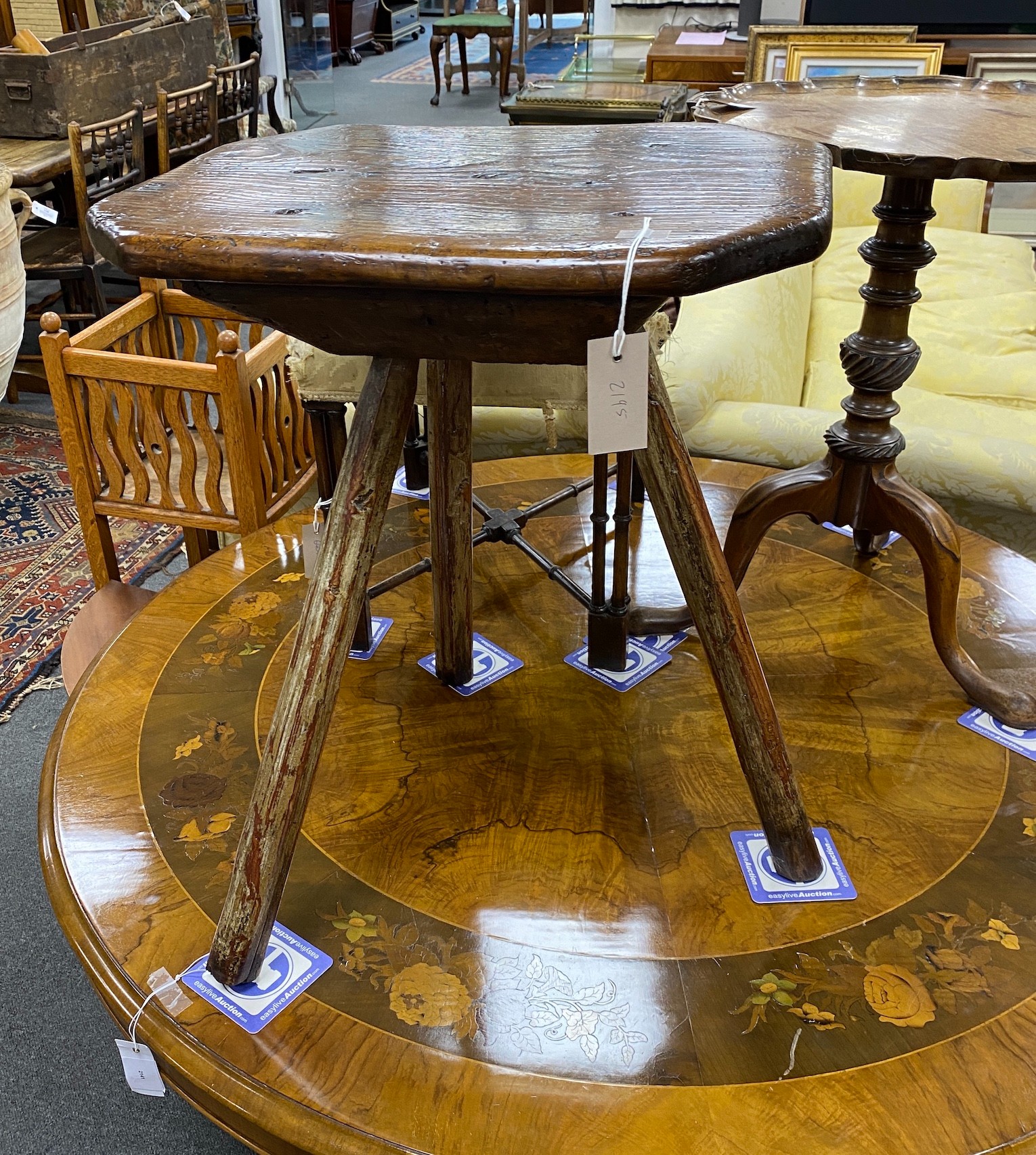 An 18th century Primitive ash and pine cricket table